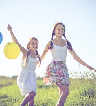 happy-little-children-playing-in-the-field-at-the-pr4dsaw.jpg